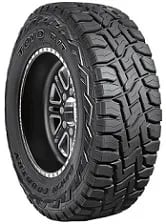 SUV tire with rugged tread pattern and raised lettering on the sidewall.