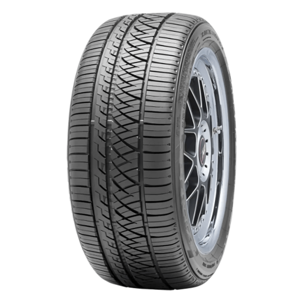 A Falken Ziex ZI960 car tire with a detailed tread pattern and a shiny metal rim, displayed against a plain white background.