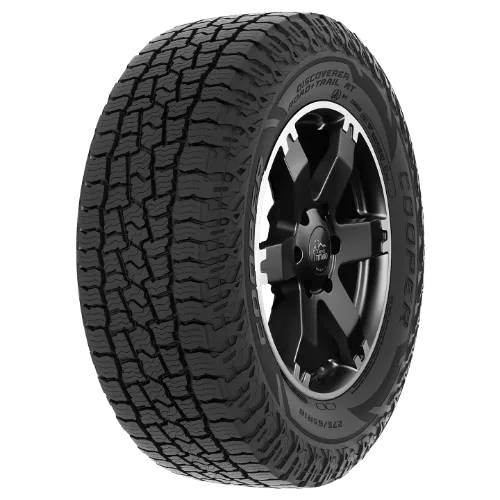 A rugged vehicle tire with a textured tread pattern and a black alloy wheel.