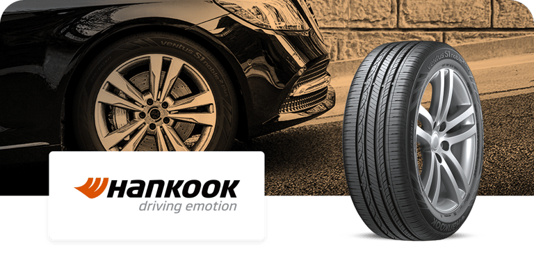 A Hankook Ventus S1 noble2 tire displayed next to a parked car, with the Hankook logo and slogan 'driving emotion' shown below.