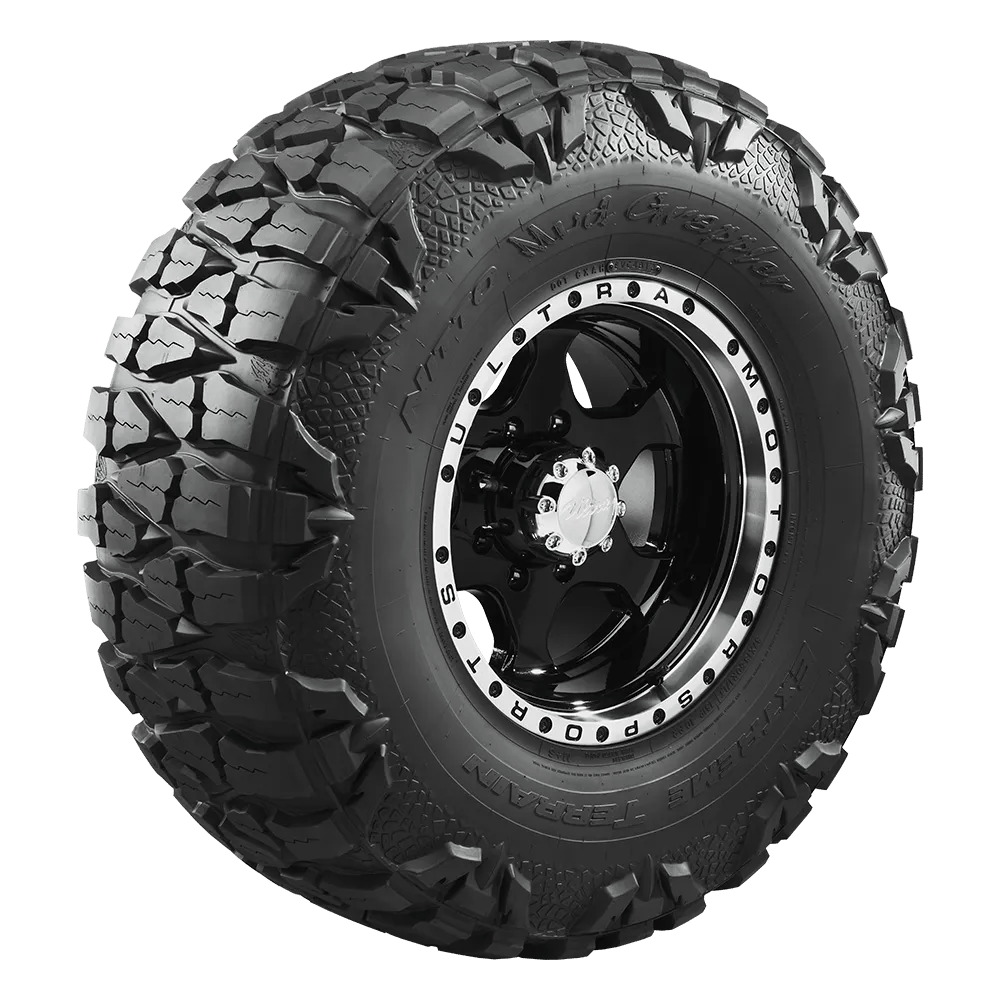A Nitto Mud Grappler tire with the lizard skin option showing and mounted on an Ultra Motorsports wheel.