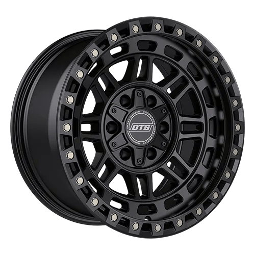 Black alloy wheel with a rugged multi-spoke design and metallic accents around the rim.