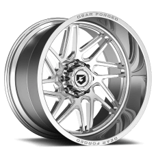 A silver alloy car wheel with a multi-spoke design and a branded center cap, featuring the name 'GEAR FORGED' inscribed on the rim.