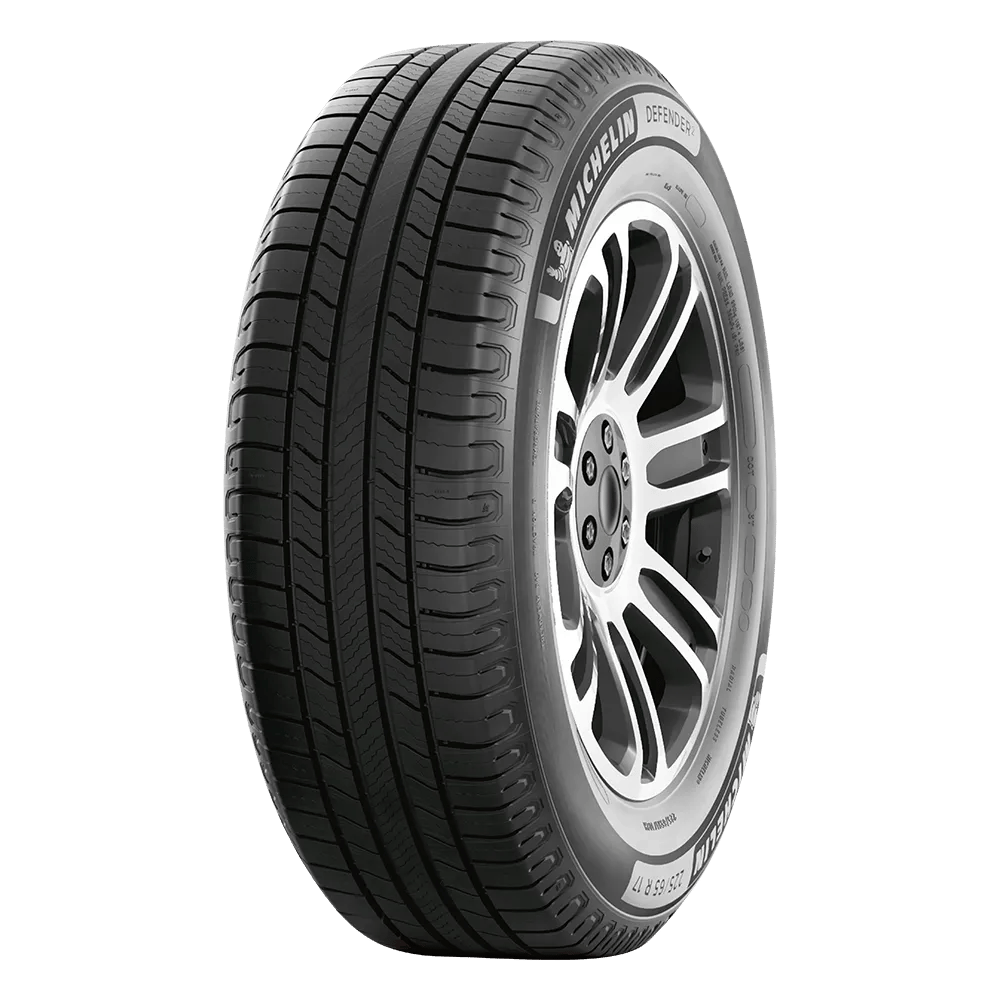 A Michelin Defender 2 tire featuring a detailed tread pattern and sidewall design, mounted on a silver alloy wheel.