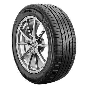 A Nexen Roadian GTX tire with an alloy wheel, featuring a detailed tread pattern and black sidewall lettering.