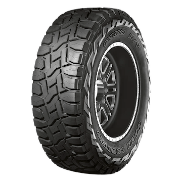 A rugged all-terrain Toyo Open Country tire with deep treads designed for off-road use.
