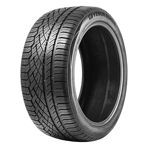 A black Venom Power tire with detailed tread pattern and sidewall logo.