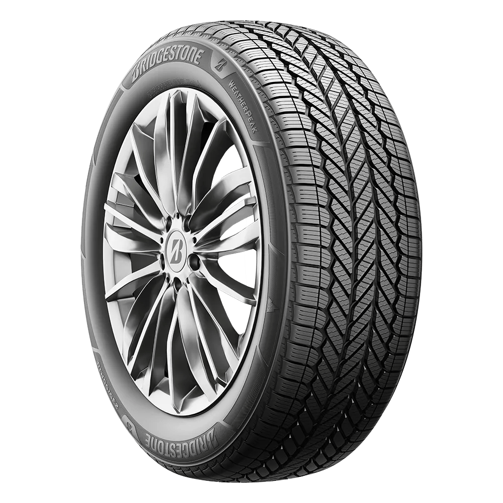 A Bridgestone WeatherPeak tire mounted on a multi-spoke polished chrome rim.