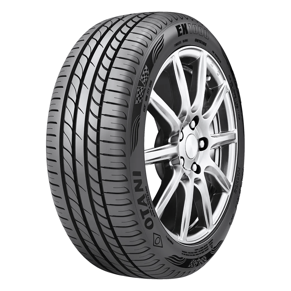 An Otani EK1000 tire mounted on an 8-spoke shiny chrome rim.