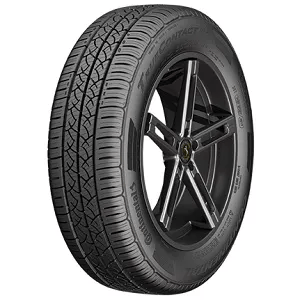 A black car tire with tread patterns, mounted on a black alloy wheel.