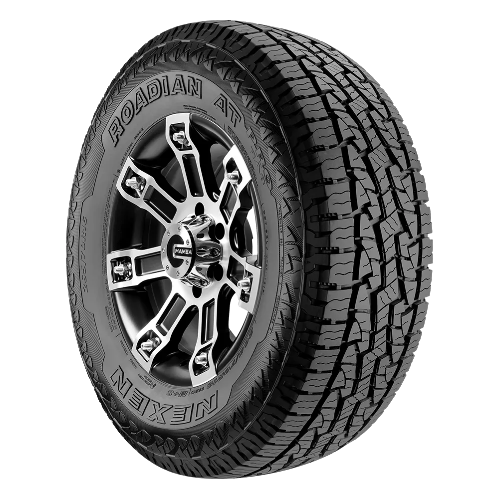 A Nexen Roadian AT Pro RA8 tire featuring a rugged tread pattern suitable for all-terrain use, with a detailed rim design showing multiple spokes and the Mamba logo at the center.