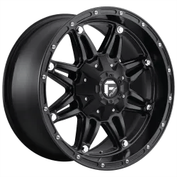 Black alloy wheel with a multi-spoke design and silver bolt accents.