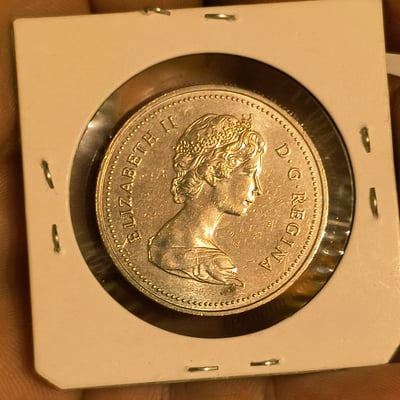  Canadian 1 Dollar coin in protective holders - Image 1 of 2