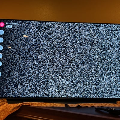 Flat-screen LG TV with remote - Image 1 of 4