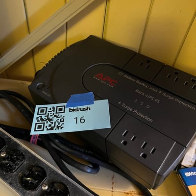 Surge protectors, power strips, and a UPS backup battery - Image 1 of 5