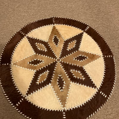 Round brown stitched pouf rug - Image 1 of 2