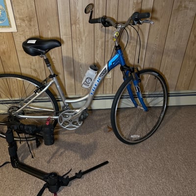Trek 7000 Aluminum Hybrid Bicycle with Water Bottle and Portable Bike Trainer - Image 1 of 7