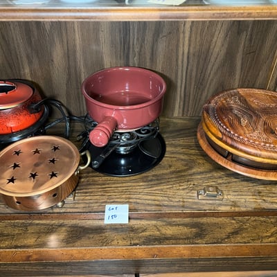Vintage kitchenware collection: glass segmented serving tray, ceramic pot on burner stand, carved wooden serving piece, and metal scroll trivet - Image 1 of 6