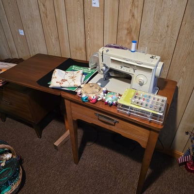 Singer sewing machine with knitting books and craft supplies - Image 1 of 21