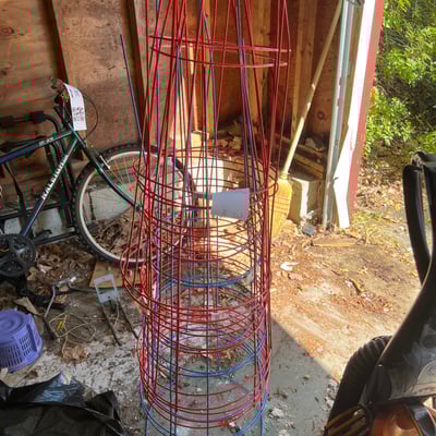 Red and blue metal tomato cages - Image 1 of 3
