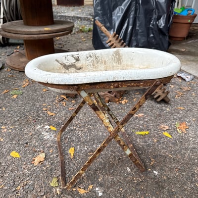 Weathered enamel infant tub basin on rusted folding stand - Image 1 of 9