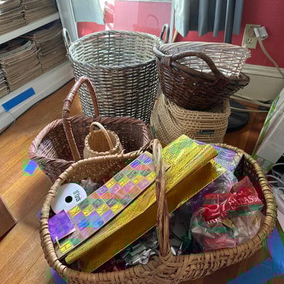 Assorted wicker baskets with gift wrap supplies - Image 1 of 7