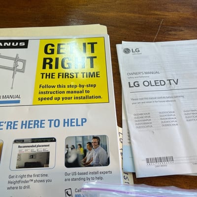 Wall-mounted LG LED TV with mounting hardware, accessories - Image 2 of 5