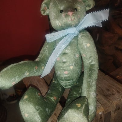 Green teddy bear plush with blue ribbon - Image 1 of 2