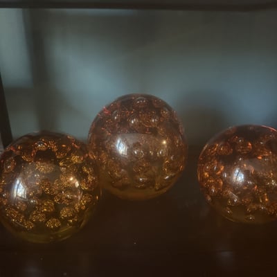Three Amber Glass Spheres with Bubble Inclusions - Image 1 of 5