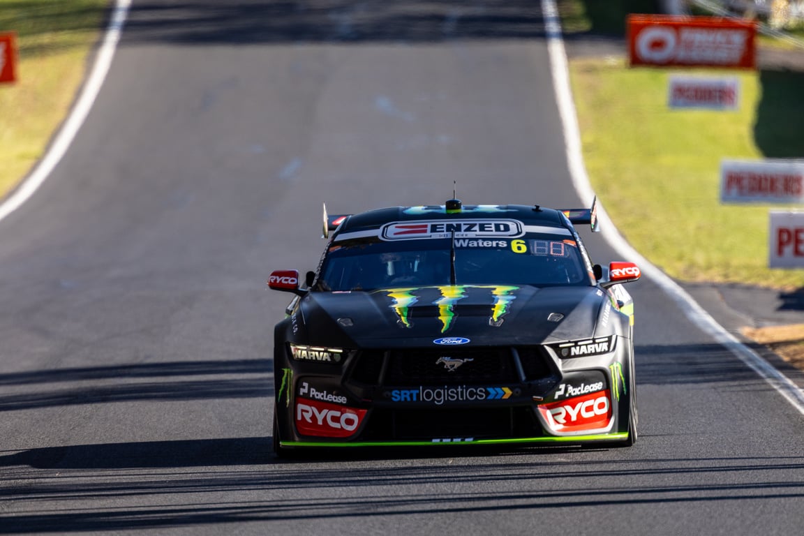 Black Ford Mustang Supercars car number 6 driven by Waters races down the track.