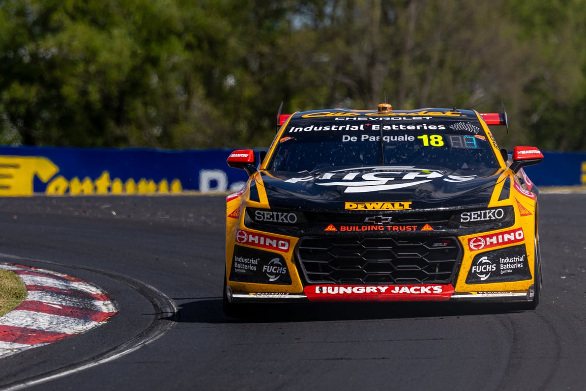 Team 18 Chevrolet Camaro Supercar racing through a corner at Mount Panorama