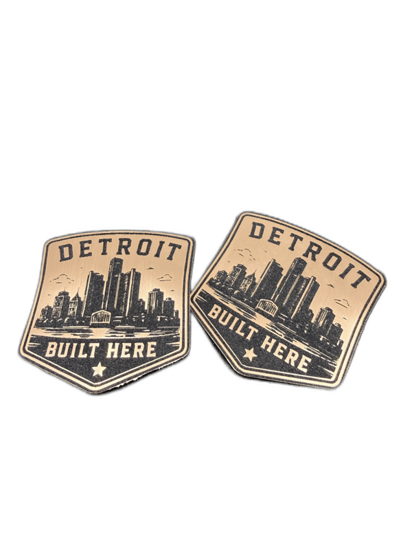 Detroit Built Here shield-shaped copper emblem with city skyline silhouette