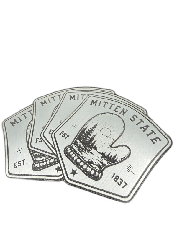 Mitten State EST 1837 silver shield emblem with mitten silhouette and pine trees