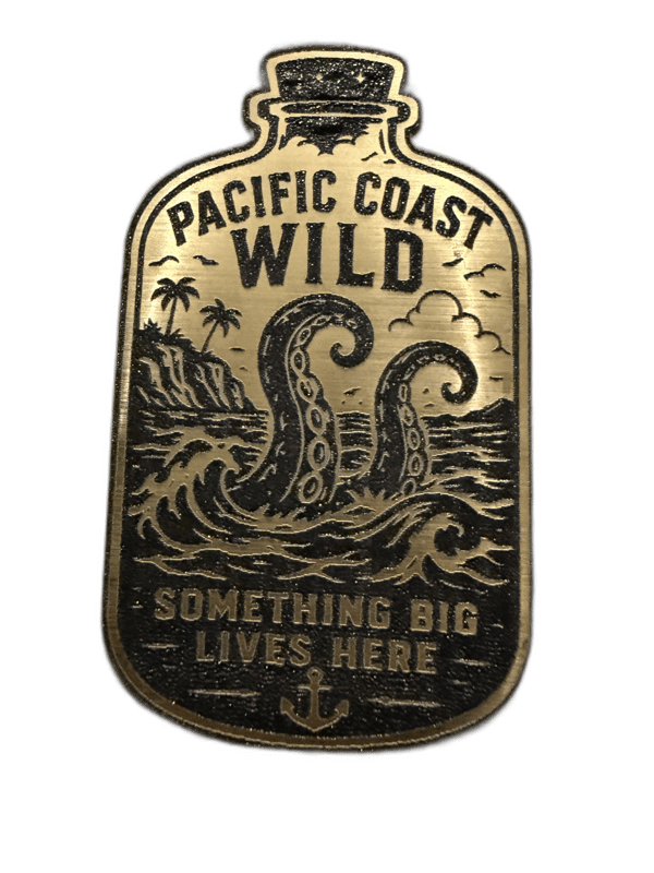 Pacific Coast Wild bottle-shaped gold emblem with kraken tentacles, cliffs, and waves