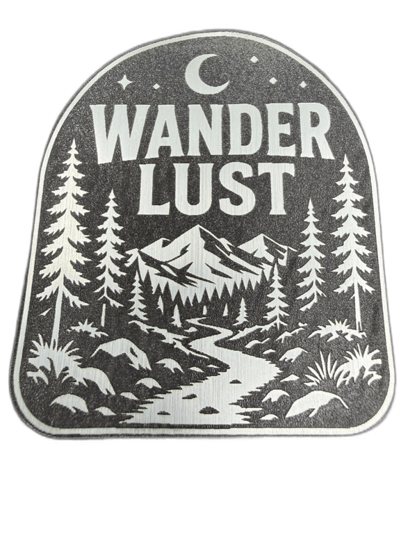 Wander Lust silver shield emblem with crescent moon and pine forest scene