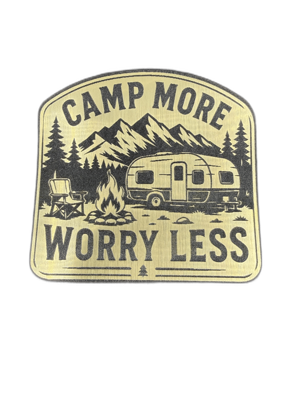 Wanderlust vintage shield-shaped silver emblem with mountain and pine trees