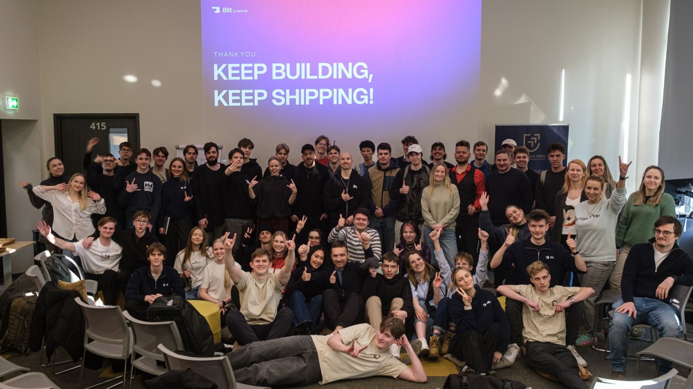 Bilt hackathon group photo in front of a “Keep building, keep shipping” screen