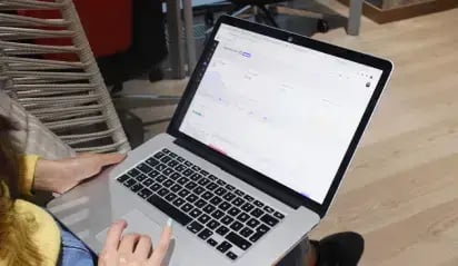 Webtures teammate working on laptop