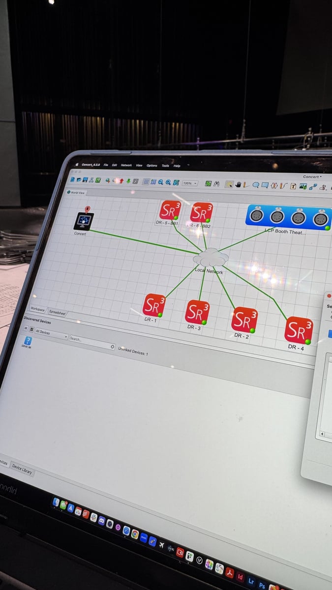A laptop running ETC Concert in the theater, showing the building's Sensor dimmer racks on the network map