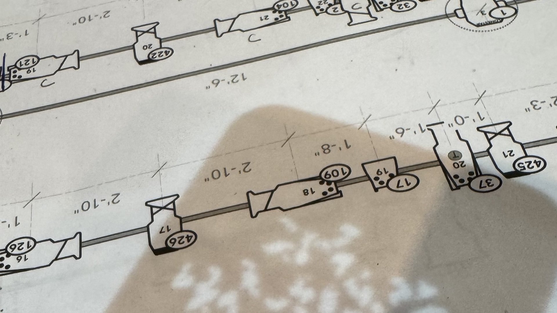 A printed page of the Blake rep plot with a breakup gobo projected across it during focus