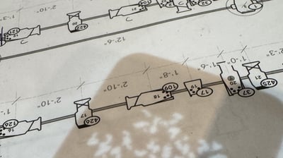 A printed page of the Blake rep plot with a breakup gobo projected across it during focus