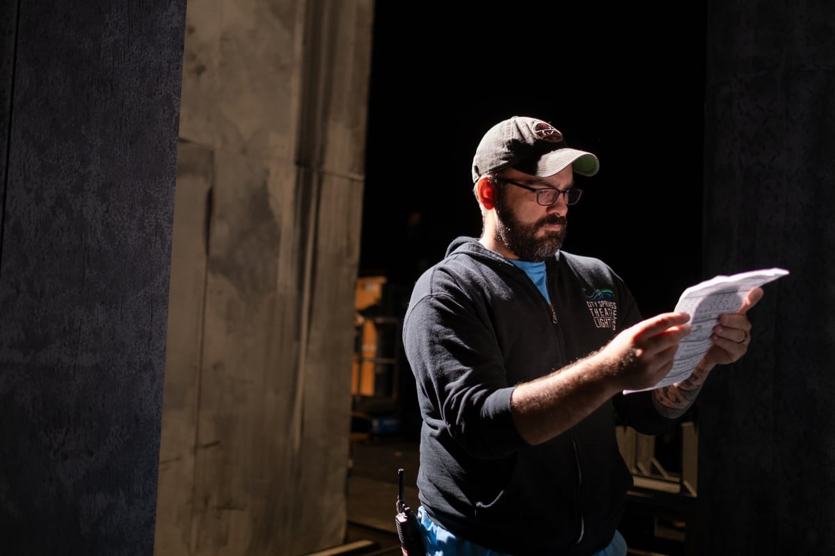 Reviewing paperwork in the house during tech.