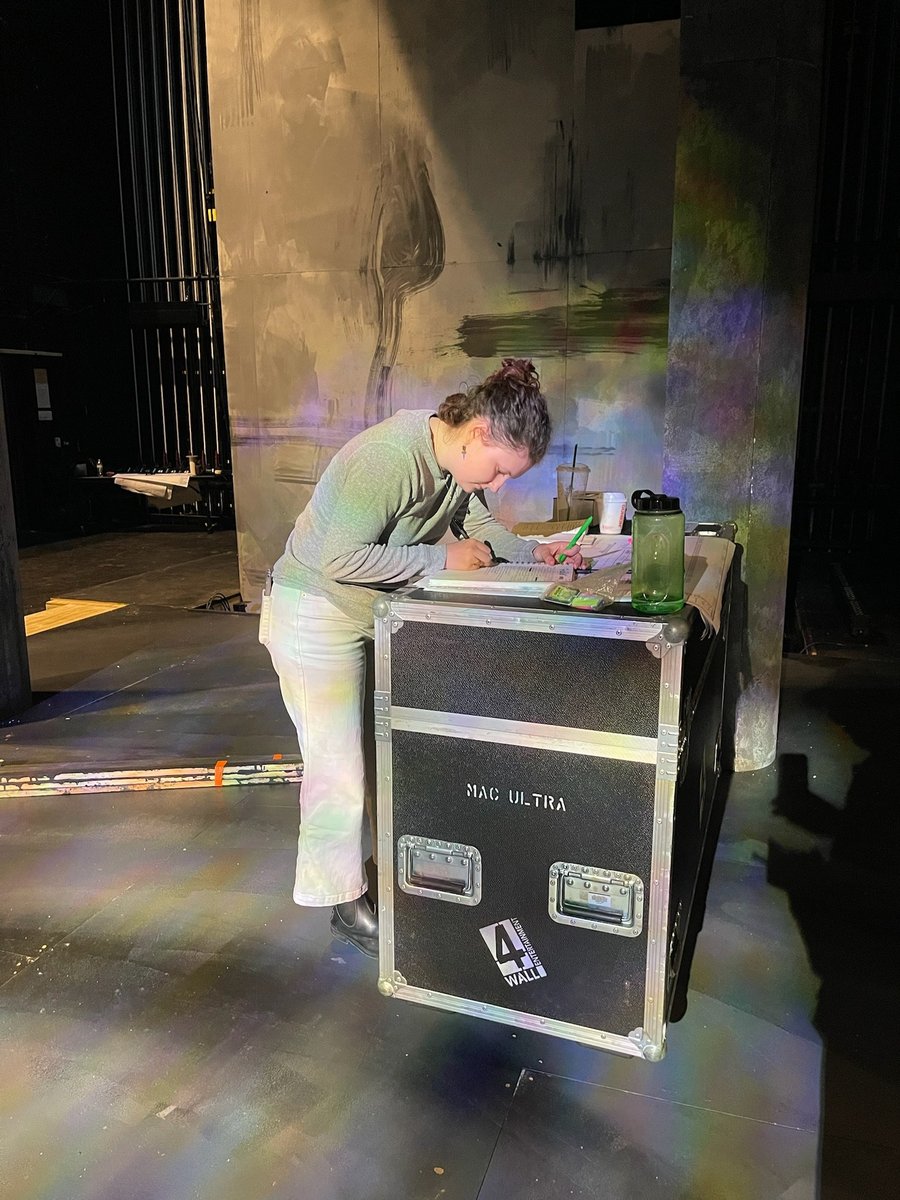 Working on overhead rigging from a lift backstage.