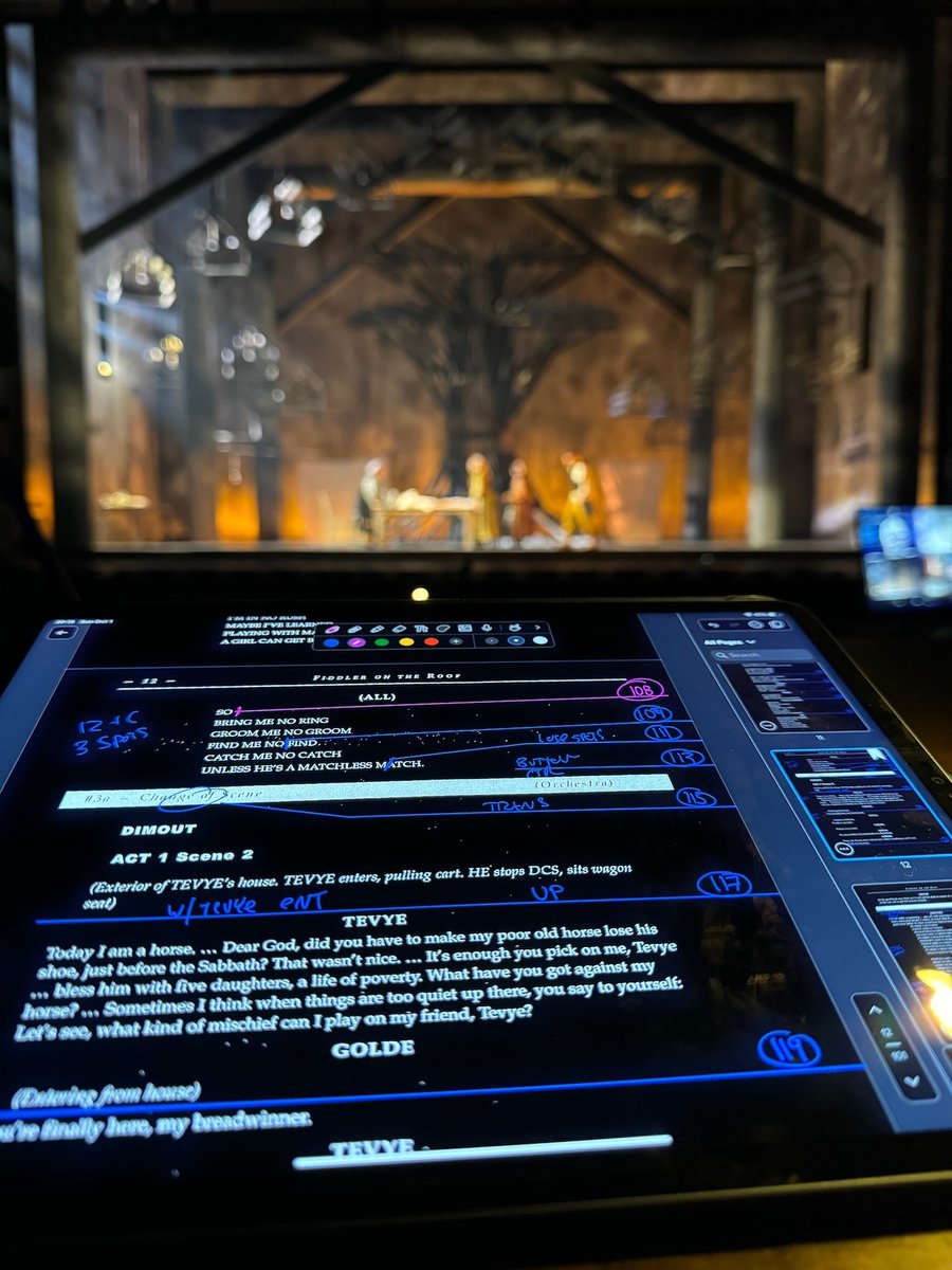 The lit village set behind the Eos programming monitor.