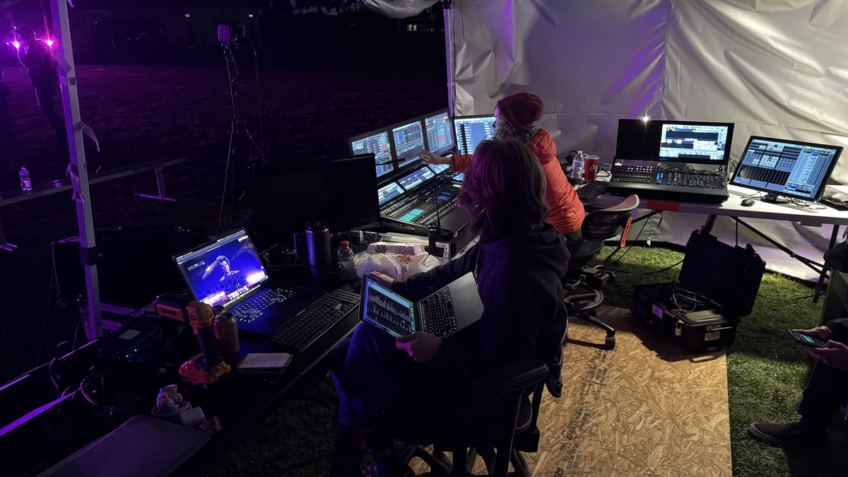 The outdoor control table under the tent during the drone show.