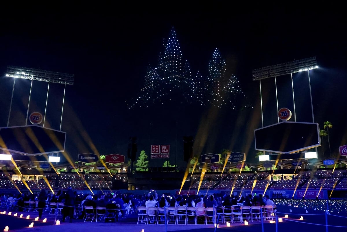 The Hogwarts castle drone formation over UNIQLO Field with the audience seated on the field below