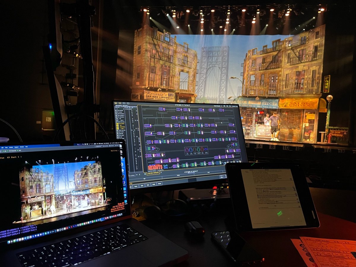The tech table with the Washington Heights set lit onstage and the Eos magic sheet on the monitors.