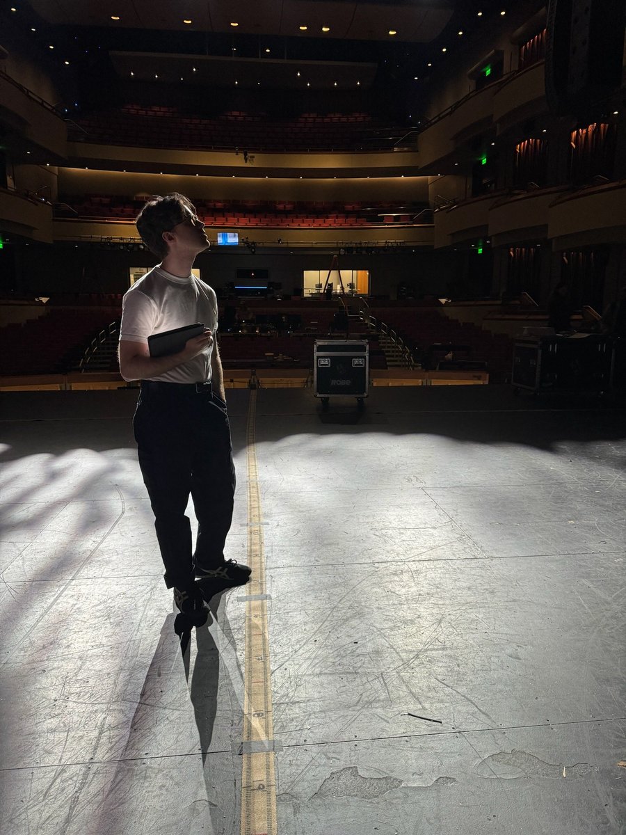 A figure stands in a single special during a focus session in the empty house.
