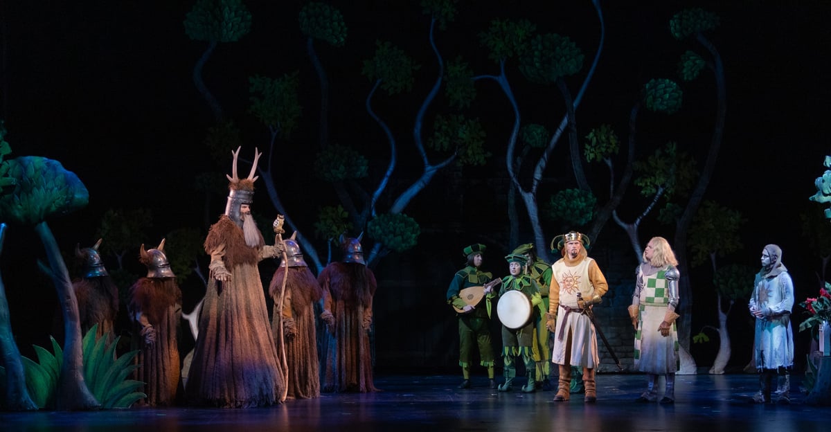 The towering antlered Knight of Ni and his followers confront Arthur's party in the dark forest