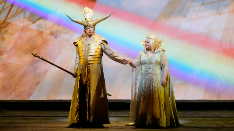 Greer Grimsley as Wotan and Elizabeth DeShong as Fricka prepare to cross the rainbow bridge in Das Rheingold